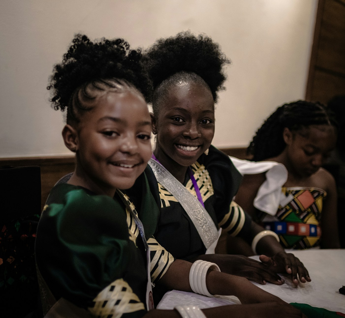 Young people smiling together at a community event